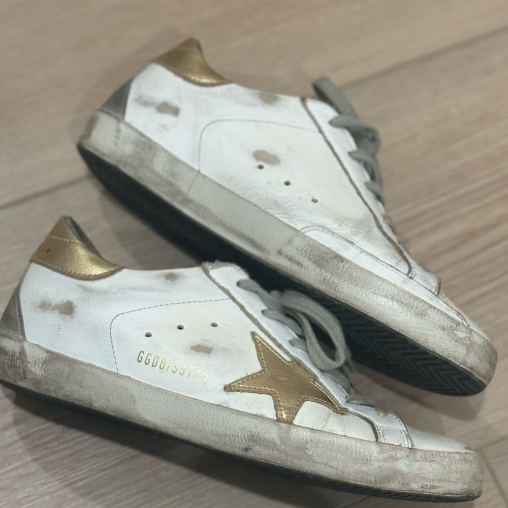 Golden goose superstar white and gold